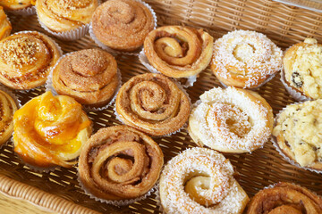 Rows of Delectable Freshly Baked Danish Rolls and Pastries a the Bakery