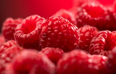 Fotobehang Raspberry fresh berries closeup, ripe fresh organic Raspberries over red background, macro shot. Harvest concept © Subbotina Anna