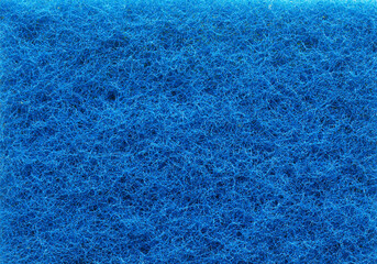 Texture of a blue plastic fiber sponge