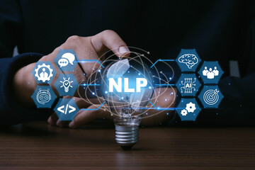 Businessman hand touch light bulb with NLP - Neuro linguistic programming concept. AI, Chat bot,...
