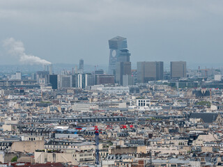 Paris, France, April 19, 2024: Tours Duo towers in the 13th arrondissement of Paris, where there are offices, Natixis bank, hotel, restaurant with terrace overlooking Paris, auditorium, green terrac - obrazy, fototapety, plakaty