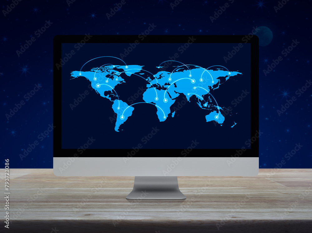 Poster connection line with global world map on computer monitor screen on wooden table over fantasy night 