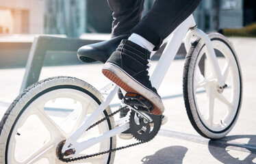 Outdoor, legs of person and riding bicycle for hobby, daily activity and cycling for fun. Outside,...