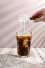 coffee on a beige background in a glass