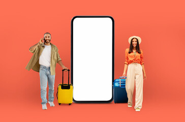 Travel-ready couple by blank phone screen