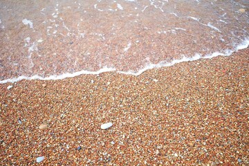 Lots of small colorful pebbles from the seashore