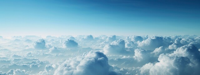 a blue sky with white clouds from above,