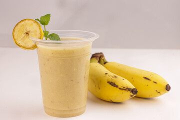Banana Smoothies in a Glass with Banana Fruit.