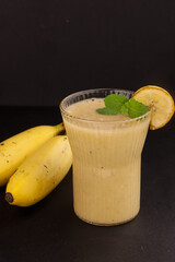 Banana Smoothies in a Glass with Banana Fruit.
