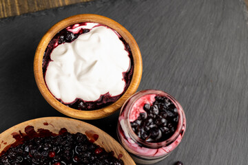 fresh creamy yogurt with berries and blueberry jam