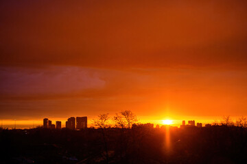 Dramatic sunrise and cityscape