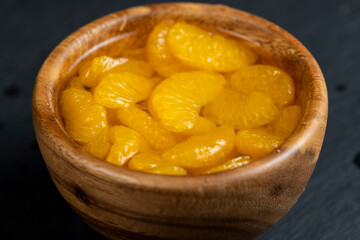 ripe small slices of tangerines in sweet syrup
