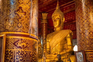 The gold Buddha statue at Wat Mai Suwannaphumaham in Luang Prabang, Laos