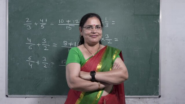 Confident indian female math teacher wearing sari standing cross arms looking at camera in classroom, Education, academic,Occupation,Women empowerment