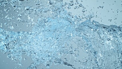 Water Splashes Flying in the Air on Blue Background