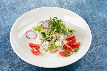 russian salad on the white plate