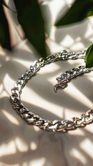 Elegant 925 sterling silver cuban chain link on a background surface showcasing a luxurious design and reflective quality. Product design inspiration for jewelry