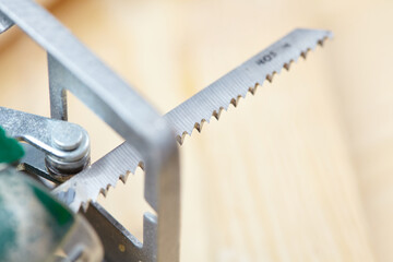 electric fretsaw on a wooden table