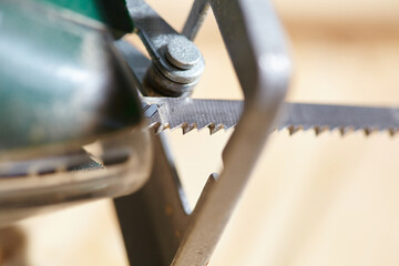 electric fretsaw on a wooden table