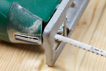 electric fretsaw on a wooden table