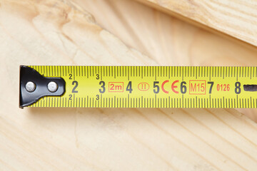Yellow tape measure on the table