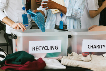 young people are engaged in charity and volunteering, selecting clothes for recycling and charity