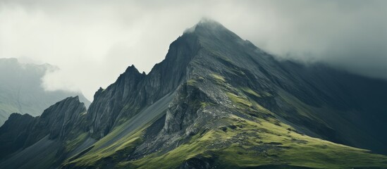 Mountain with scattered clouds - obrazy, fototapety, plakaty