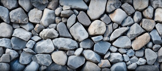 Naklejka premium Pile of stones against dark backdrop