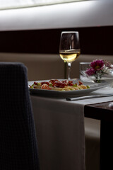 Colorful Salad with White Asparagus, Iberic Ham and Citrus Mayonnaise - Refreshing Summer Dish Served on Restaurant Table