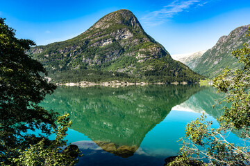 Mountain lake in Norway. Turquoise water of lake of glacial origin. Delightful amazing view of the...
