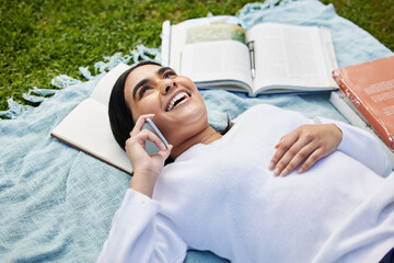 Relax, phone call and girl on grass at campus with blanket, books and happy conversation at...