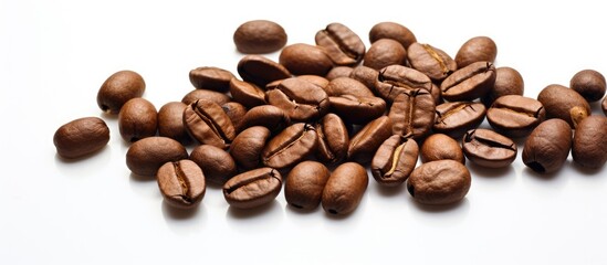 Fototapeta premium A close-up of a heap of roasted coffee beans on a bright surface