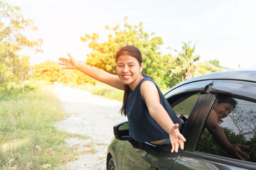 Asian women travel relax in the holiday. Traveling by car park. happily With nature, rural forest. In the summer