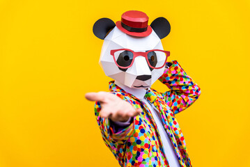 Man with funny low poly mask on colored background