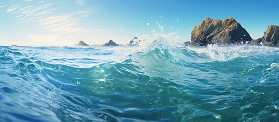 A calm ocean wave with rocks backdrop