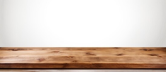 A wooden desk against white wall