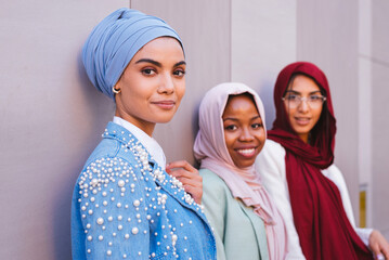 Beautiful muslim girl wearing hijab bonding outdoors