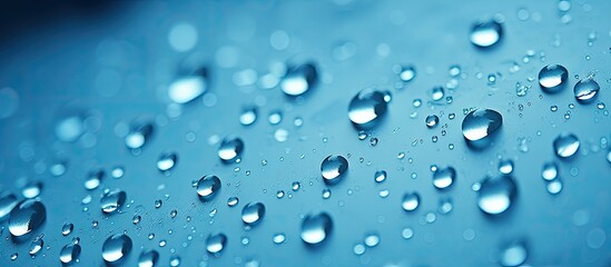 Blue background with water droplets close up - obrazy, fototapety, plakaty