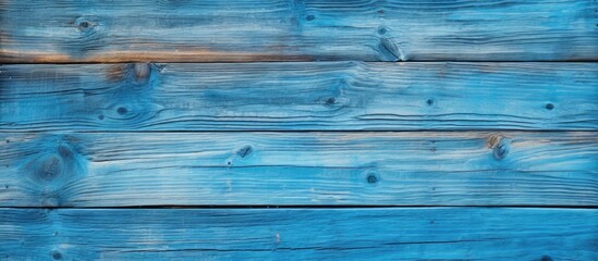 Fototapeta na wymiar Blue wooden wall with natural knots