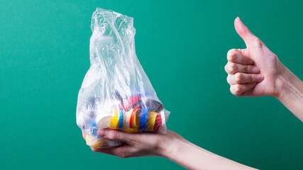 women's hands hold recyclable plastic lids