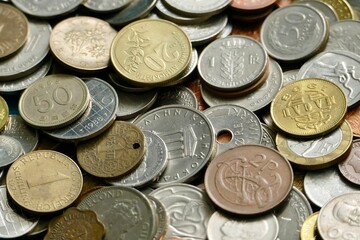 pile of coins from various countries