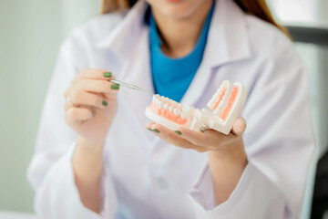 Dentist checks patient's dental health Who comes to consult about teeth