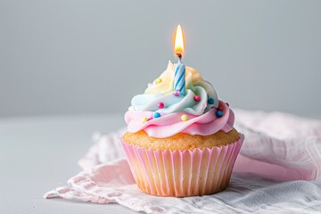 Single Cupcake With Lit Candle Celebrating a Birthday in a Softly Lit Setting