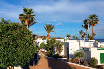 Bungalows at tropical island. Tourist resort of beach of Playa del Carmen, Lanzarote, Canary Islands, Spain