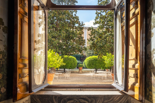 Details from the sumptuous and rich interior of the Palazzo Colonna in Rome, Italy. Looking out the window to the beautiful courtyard.
