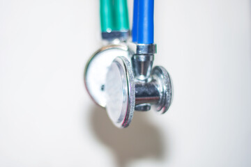Close up of stethoscope with green and blue handles