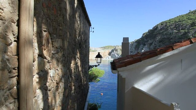 Detail of walls and roofs with street lamp typical of Sa Tuna. Begur, Costa Brava, Catalonia, Spain.
