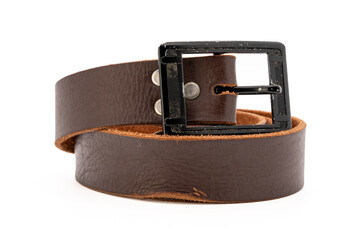 Worn Men's leather belt in a dark brown color with a metal buckle on white background. Side view, close-up.