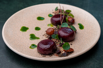Delectable fine dining beets, marinated to perfection, plated artistically with fresh greens and puree drops.