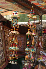 Stack of traditional Plates and handmade ceramics, handmade colorful dishes , Handicraft kettle item, Colorful Handmade Pottery and Ceramics, Souvenir Shop in lok virsa mela Islamabad
